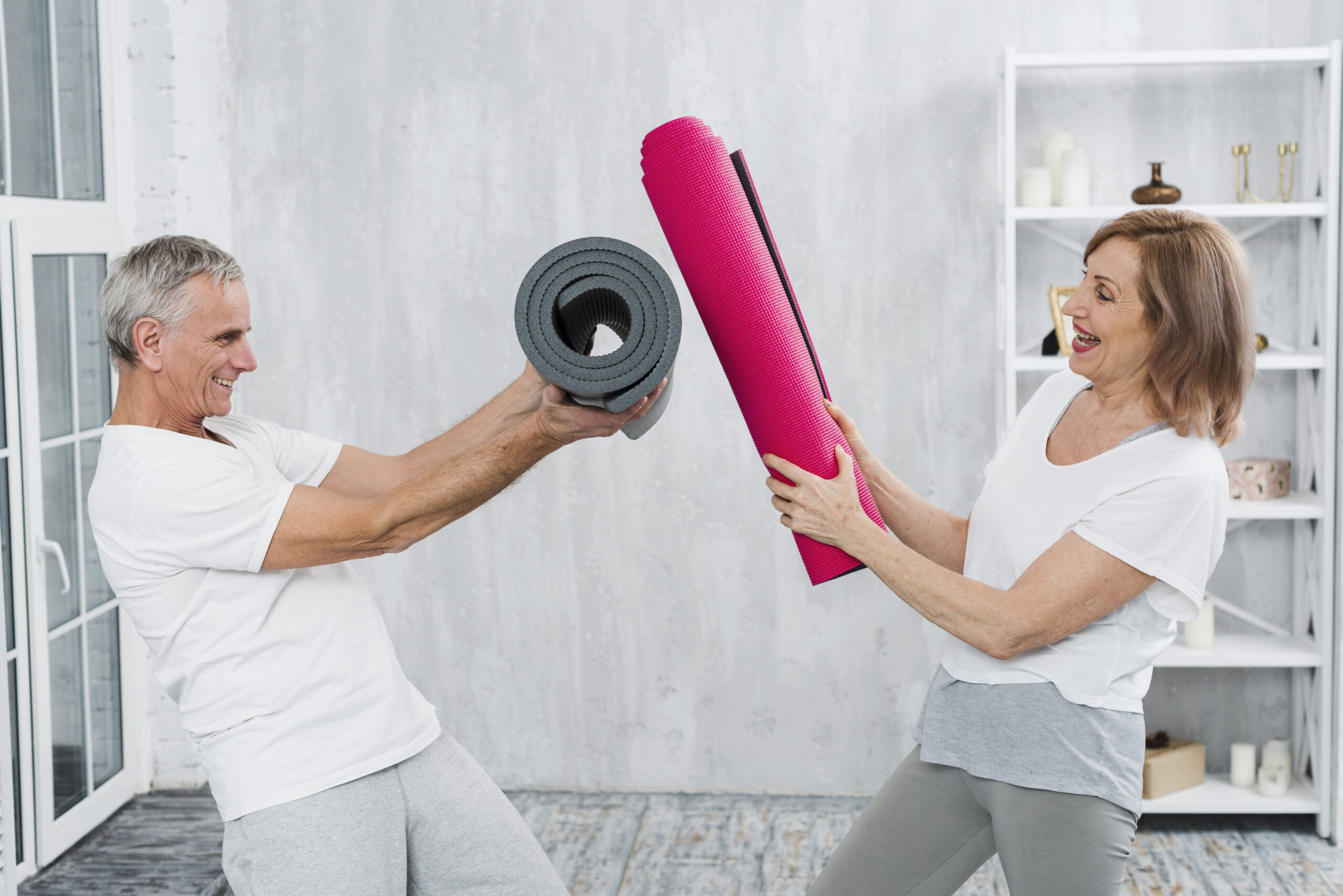 https://scadservices.com.au/wp-content/uploads/2024/04/playful-senior-couple-fighting-with-yoga-mat-roll-scaled.jpg